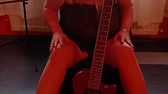 Blonde Milf Masturbates With Guitar Next To Her Breasts