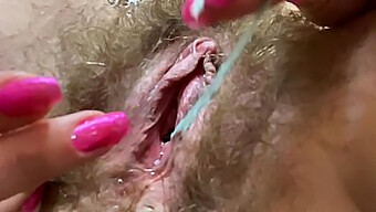 Closeup Of A Hairy Pussy Squirting During Masturbation