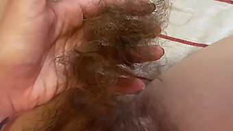 Close-Up Video Of A Girl Trimming Her Long Pussy Hair At Home